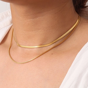 Detail of 18K gold plated stainless steel snake chain and box chain layered together