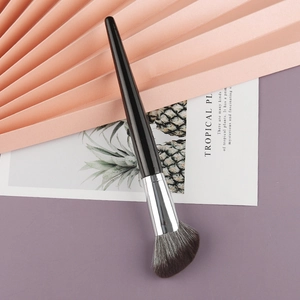 Detail of angled contour brush with soft synthetic bristles and sleek black handle