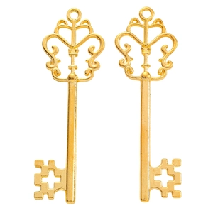 Pair of vintage golden alloy key charms with hollow butterfly and cross designs
