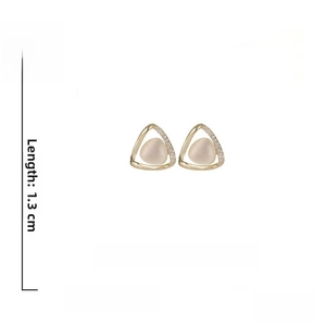 Detail of triangle cat eye stone earrings with gold alloy frame and crystal accents