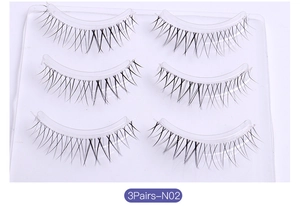 Detailed close-up of 3 pairs of N02 natural spiky false eyelashes on a clear tray
