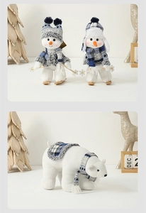 Detail of plush snowman and polar bear figurines with Mediterranean blue winter scarves
