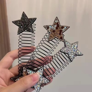 Detail showing three colors of rhinestone star hair combs with black spring comb structure