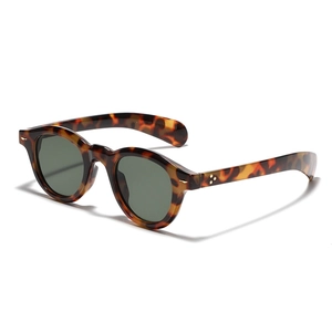 Classic round tortoiseshell sunglasses with dark green lenses and silver metal rivets
