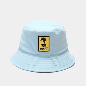 Close-up of light blue bucket hat with yellow GO AWAY palm tree embroidery detail