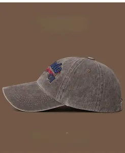 Close-up of vintage washed cotton baseball cap with retro 3D embroidery and metal eyelets