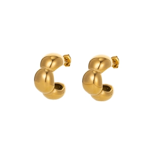 Detailed macro view of gold cloud-shaped hoop earrings with polished metallic texture