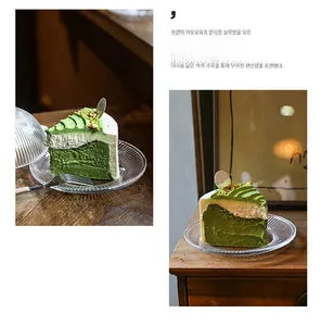 Macro detail of matcha mousse cake with cream layers and nuts on a wooden table