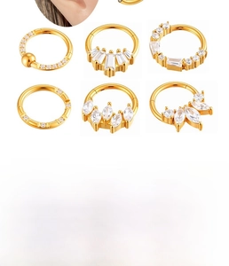 Dettagli di anelli per piercing in acciaio con zirconi in finiture argento e oro