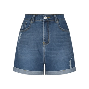 Detail of high waisted dark blue denim shorts with rolled hems and distressed texture
