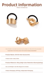 Close-up of elegant gold alloy bow hair clip and elastic hair ties with metal accents