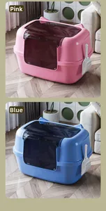 Pink and blue large enclosed cat litter boxes with scooper in home setting