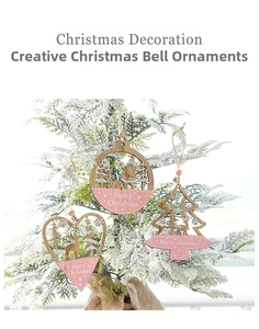 Close-up of pink painted wooden Christmas ornaments with hollow reindeer and Santa carvings