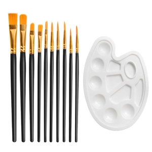 Close-up of 10 painting brushes with nylon hair and a white plastic palette for art DIY