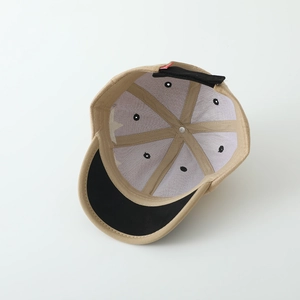 Detailed interior of khaki cotton baseball cap with adjustable strap and reinforced stitching