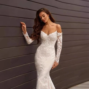 Elegant ivory lace mermaid wedding dress with off-shoulder long sleeves and floral embroidery