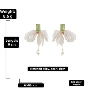 Detailed view of organza bow earrings with pearls and 925 silver needle specifications
