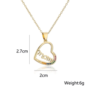Macro detail of gold-plated heart MOM pendant necklace with colorful cubic zirconia