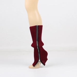 Macro shot of dark red knit leg warmer with black zipper and silver triangular pull