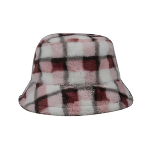 Close-up of pink and brown plaid faux fur bucket hat showing soft fleece texture