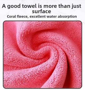 Close-up of pink coral fleece car towel showing ultra-absorbent thick fiber texture