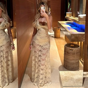 Mirror selfie showing the intricate lace texture and slim fit of the long beige dress