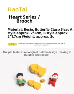 Detail of cartoon heart brooch showing the buried pin structure and secure butterfly clasp