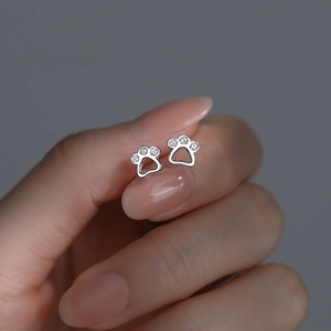 Minimalist S999 sterling silver cat paw stud earrings with shimmering zircon stones