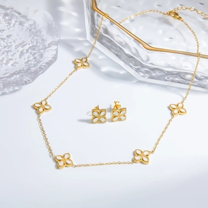 Elegant gold stainless steel four-leaf clover necklace and earrings set with white inlay