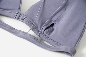 Detailed macro view of the seamless stitching and greyish purple ribbed fabric on the bralette