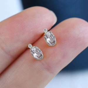 Minimalist vintage oval stud earrings with silver plating and clear sparkling stones