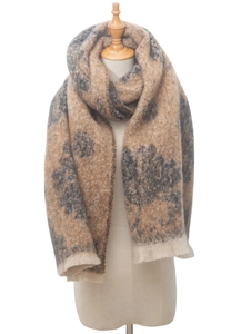 Detail of soft brown floral scarf with fringe edge on a mannequin in a studio setting