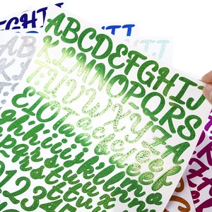Macro view of 1-inch glitter alphabet stickers showing 3D texture and sparkling colors