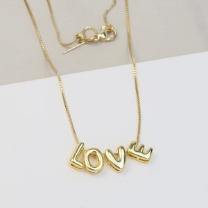 Detail of gold 18k bubble LOVE letter pendant with adjustable slide buckle box chain