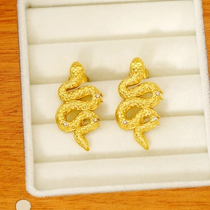 Gold snake earrings with cubic zirconia inlay, vintage streetwear style jewelry
