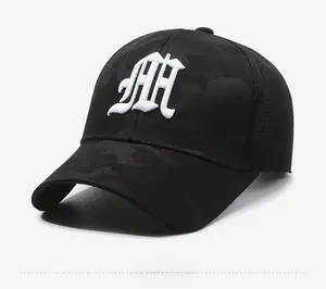 Detail of 3D embroidered M on camouflage mesh baseball cap with breathable side panels