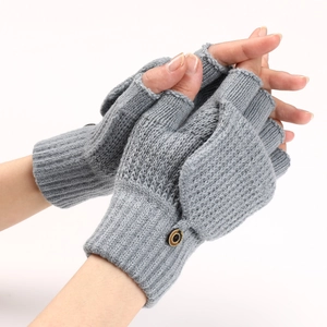 Close-up of grey knitted fingerless gloves with convertible flip top and wooden button