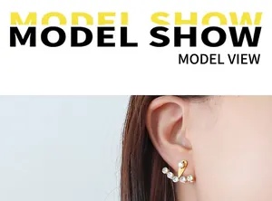 Detail of 18k gold plated crawler earrings with shimmering cubic zirconia on ear lobe