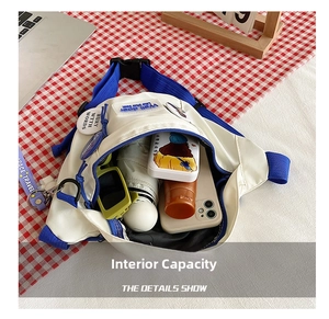 Internal capacity of the white nylon chest bag showing storage for daily items