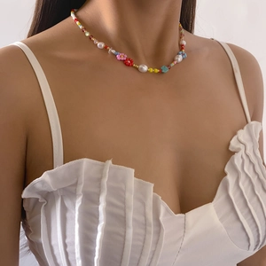 Bohemian colorful beaded daisy necklace with white pearls on a female model