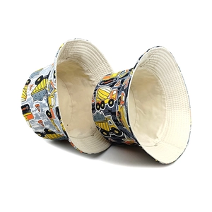 Reversible kids bucket hat with colorful construction vehicle prints for sun protection