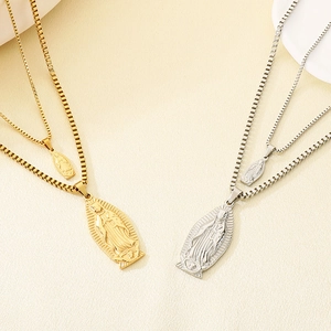 Detail of gold and silver Guadalupe Virgin Mary relief pendants on steel box chains