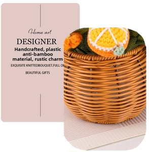 Close-up of handmade knitted oranges inside a woven basket with rural style details