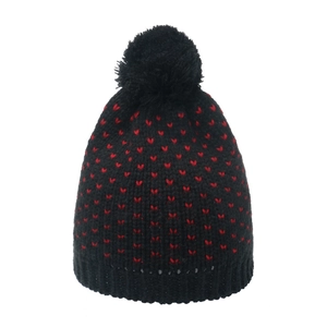 Women's black knit beanie with red heart pattern and large faux fur pompom top