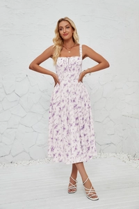 Full view of floral midi sun dress with side slit and delicate purple flower pattern