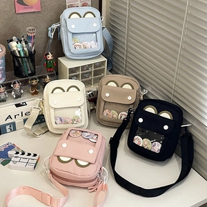 Detailed view of canvas ITA bags in five colors with clear windows for badges