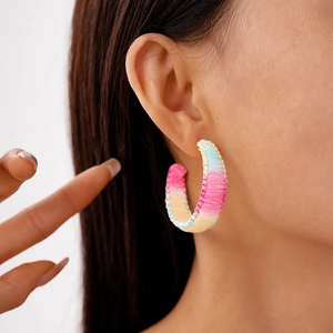 Colorful woven gradient C-shaped hoop earrings with vibrant raffia bohemian style