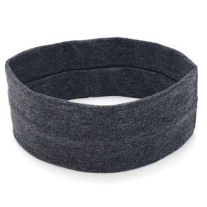 Detailed texture of dark grey elastic knitted sports headband for fitness and running