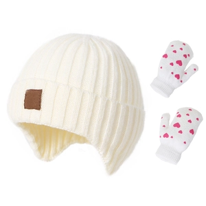 Winter knitted baby hat and glove set with ear flaps and pink heart pattern in white