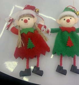 Detail of plush Christmas elf hangers in red and green with bells and candy canes